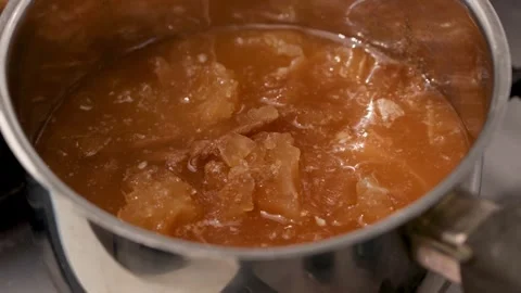 Dense Gelatinous Bone Broth with Collagen: Chilled, Spoon-Tested Texture in a Stock Footage 344032128