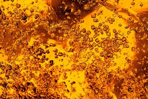 Dense golden bubble texture macro abstract background of fizzing liquid Stock Photos