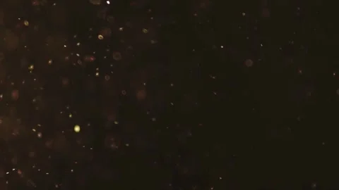 Dense golden glowing particles moving through a dark space Stock Footage 329598649