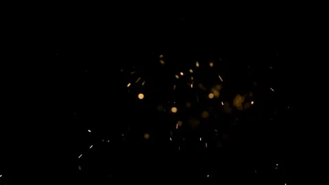 Dense golden sparks explode in slow motion Stock Footage 326756728