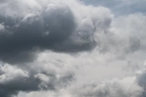 Dense gray cloud cover, nimbus layers. Soft gradient and cinematic moody aest Stock Photos