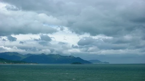Dense, Gray Clouds Billowing over Vietnamese Beach Stock Footage