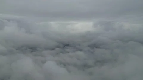 Dense gray clouds floating over mountain peak Stock Footage 345386284
