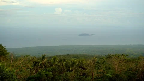 Dense green rainforest, jungle, thick clouds, high in the mountains, sea and Stock Footage 260187129