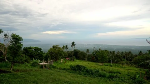 Dense green rainforests high in the mountains, a view of the settlement, the Stock Footage 272507913