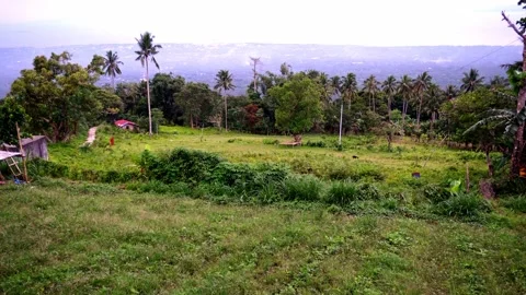 Dense green rainforests high in the mountains, a view of the settlement, the Stock Footage 272508539