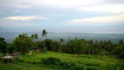 Dense green rainforests high in the mountains, a view of the settlement, the Stock Footage 272508763