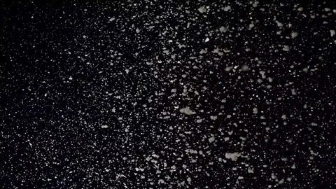 A dense heavy blizzard snowstorm VFX insert in slow-motion on black screen. Stock Footage 301896155