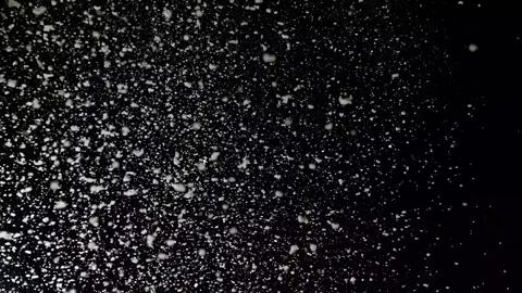 A dense heavy blizzard snowstorm VFX insert in slow-motion on black screen. Stock Footage 301896249