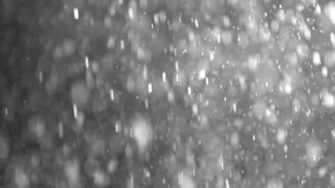 A dense heavy blizzard snowstorm VFX insert in slow-motion on black screen. Stock Footage 303661990
