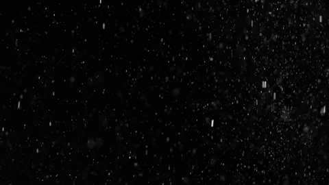 A dense heavy blizzard snowstorm VFX insert in slow-motion on black screen. Stock Footage 303662022