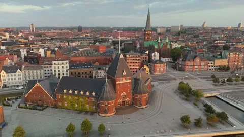 Dense historic red brick architecture and green cathedral spire in Aarhus Stock Footage 341755385