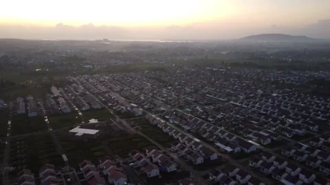 Dense housing neatly arranged with the texture of rice fields with a sunris.. Stock-Footage 285409502