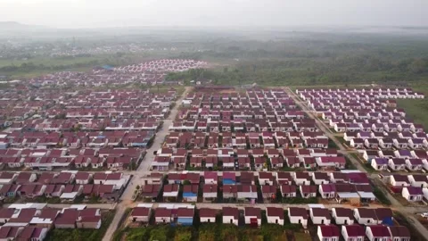 Dense housing neatly arranged with the texture of rice fields with a sunris.. Stock Footage 285413489