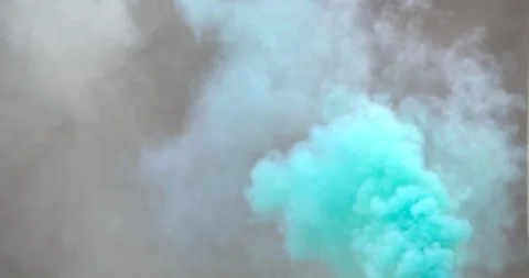 Dense light blue smoke on a middle gray background Stock Footage 98214793
