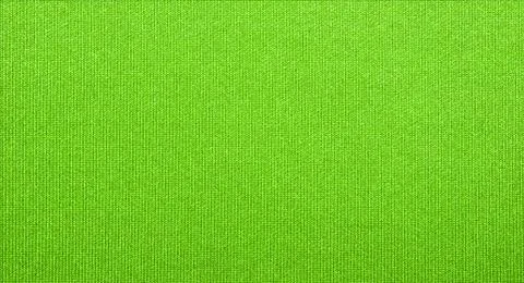 Dense light green fabric texture.Background of bright green fabric. Stock Photos