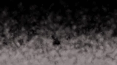 Dense lumpy vapor rises up against a black background, thinning and disappearing Stock Footage 150344288