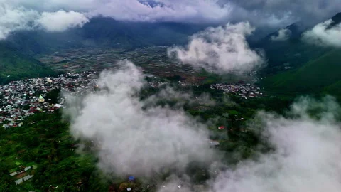 Dense mountain town aerial view through clouds in Lombok, Indonesia Stock Footage 332685382