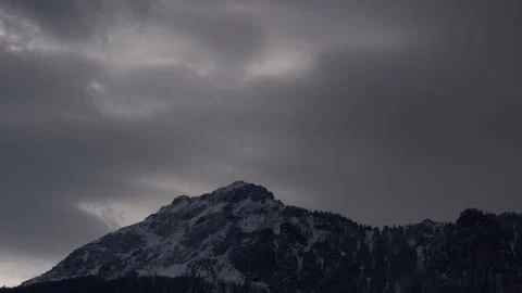 Dense moving clouds over the top of the mountain Stock Footage 152449221