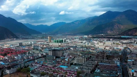 Dense Nyingchi city blocks in a broad mountain valley Video stock 345876018