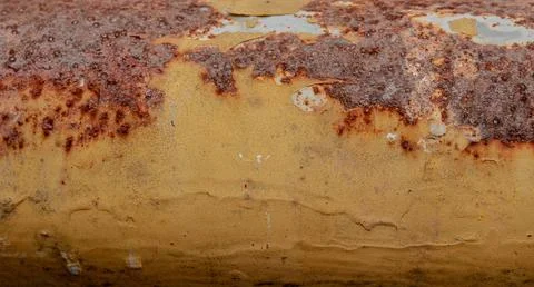Dense orange rust on weathered metal Stock Photos