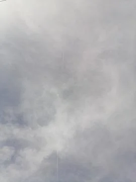 Dense Overcast Sky Texture Background with Layered Grey and White Clouds and Sof Stock Photos