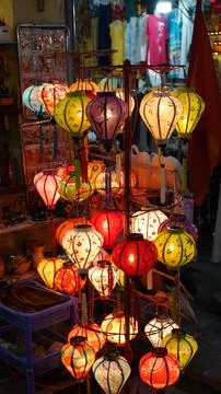 Dense Overhead Cluster of Painted Silk Lanterns in Warm and Cool Tones at H.. Stock Photos