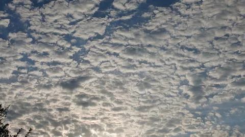 Dense Pattern of Altocumulus Clouds Covering Sky Stock Photos