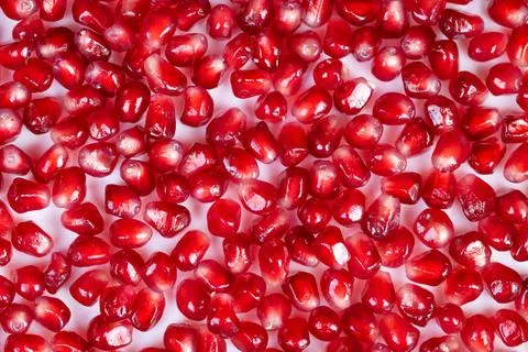 Dense pomegranate seeds pattern, ruby mosaic texture filling frame, editorial 库存照片