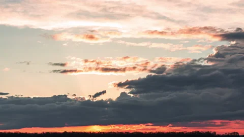 Dense rain clouds at sunset Stock Footage 153758882