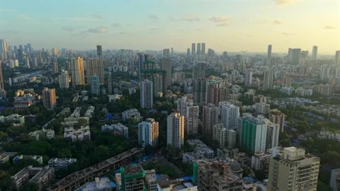 Dense residential and commercial high rise buildings with green vegetation Vídeos de archivo 320439073