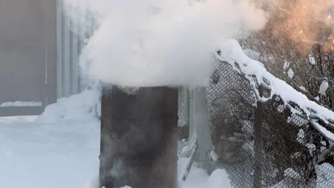Dense smoke from burning garbage in an iron barrel against the backdrop Stock-Footage 167449608