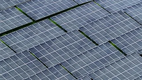 Dense Solar Panel Grid at Large Renewable Energy Farm Stock Photos