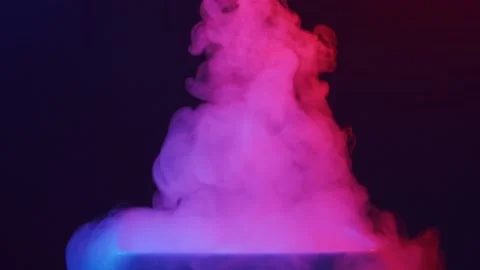 Dense steam in colored lighting on a black background. Steam slowly rises from Stock Footage 157673058