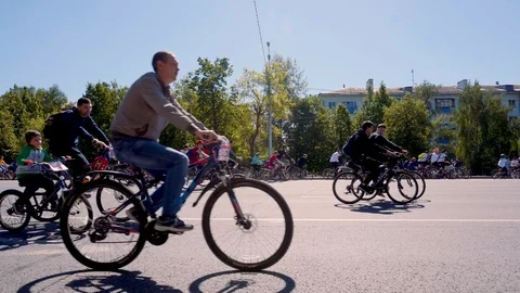 A dense stream of cyclists following each other at low speed. Stock Footage 108896672
