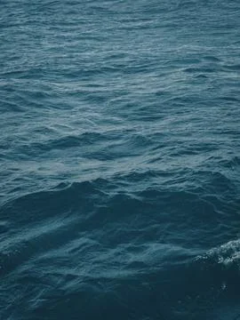 Dense surface of the water element of a deep, unusually beautiful color of the Stock Photos