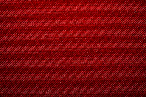Dense textile red texture.Braided red background. Foto stock