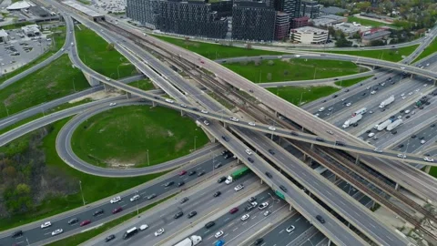 Dense traffic flows on urban road network, aerial capture shows non-stop pulse Stock Footage 275501585
