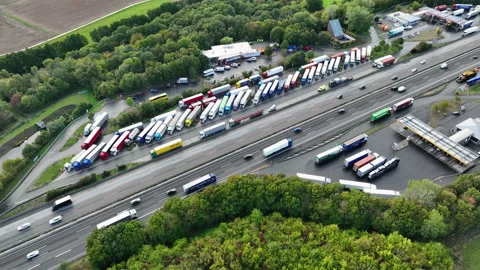 Dense traffic on highway and rest area. Drone point of view Stockbeeldmateriaal 214458656