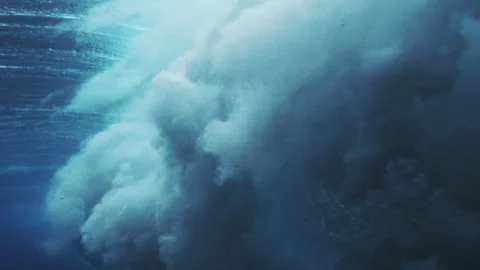Dense Underwater Wave Turbulence with Deep Blue Foam Stock Footage 328910379