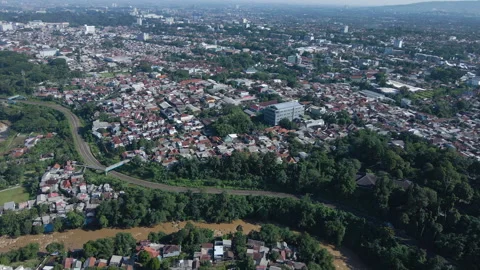 Dense Urban Area with Muddy River Aerial Stock Footage 309509660