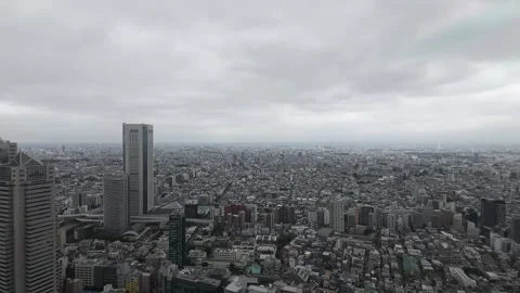 Dense Urban Cityscape Viewed from Skyscraper Under Cloudy Sky Stock-Footage 341786846