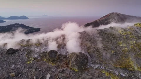 Dense volcanic smoke streams from fumaroles on  rugged Vulcano island crater Stock Footage 341675822