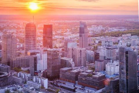 Dense Warsaw skyline at sunset with dramatic sky over Poland skyscrapers Stock Photos