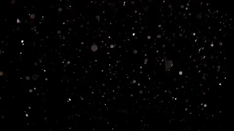 Dense white particles float through a dark space Video stock 329598100