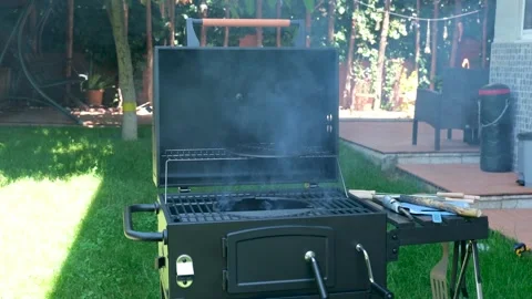 Dense White Smoke Rising from Open Barbecue Grill in Backyard Video stock 336856226