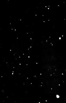 Dense white snowfall on black background, winter overlay for compositing Stock Photos