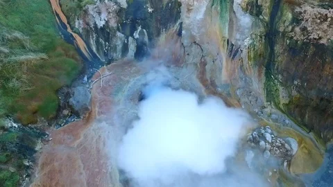 Dense white steam over large hilly greyser vertical upper Stock Footage 116599913