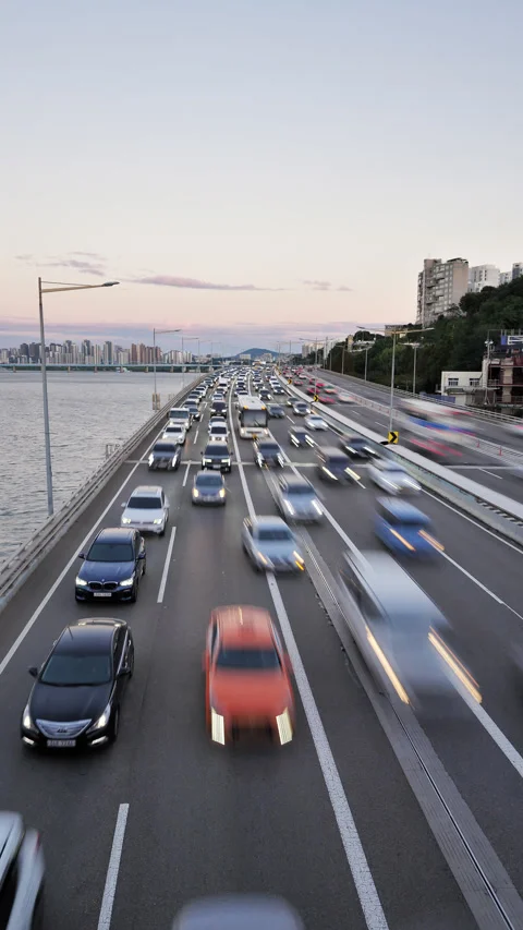 Dense yet fast traffic on Olympic Daero highway, vertical time lapse shot Stock Footage 292919522