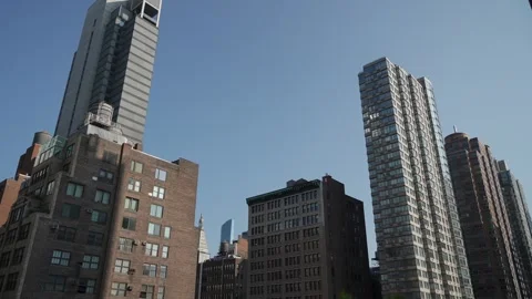 Densely Packed City Structures With Reflective Glass And Brick Facades Stock Footage 323776779